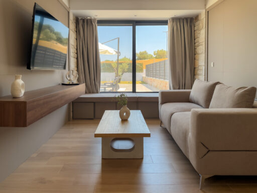 Bright living room with comfortable sofa and access to the outdoor terrace