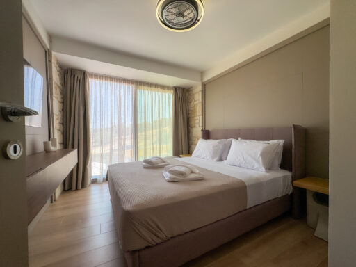 Spacious bedroom with double bed and garden view