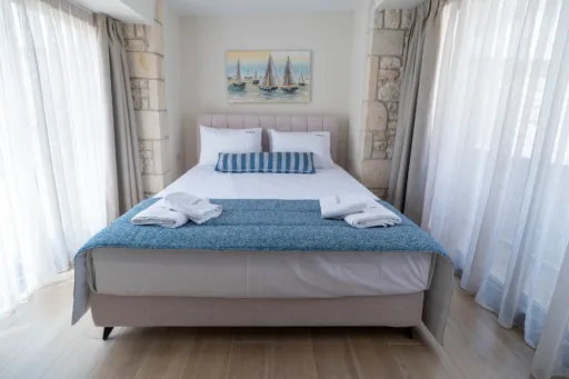 Bright double bedroom with bedside tables and natural light