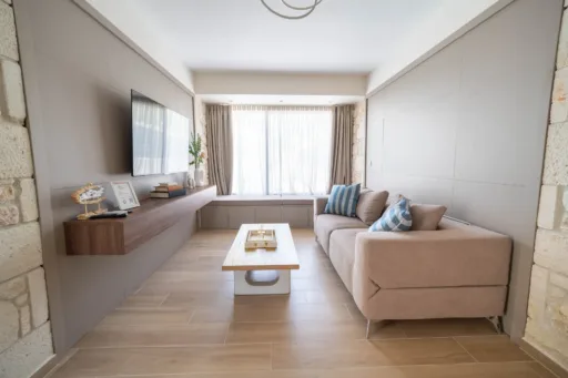 Living room with sliding doors opening to the pool