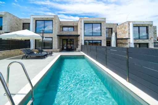 Sunbeds and umbrellas by the private pool