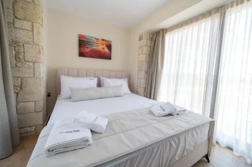 Master bedroom with double bed and natural light