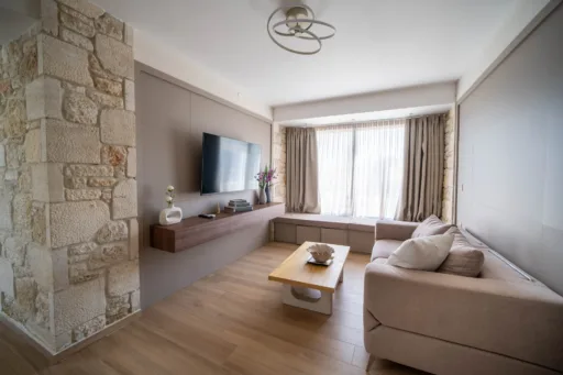 Bright living room with large windows and comfortable seating