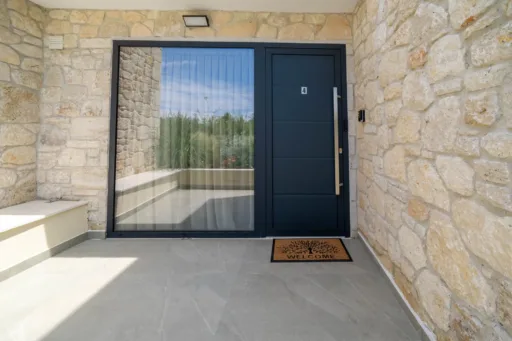 Stone wall pathway and entrance of Villa Iris rental in Halkidiki