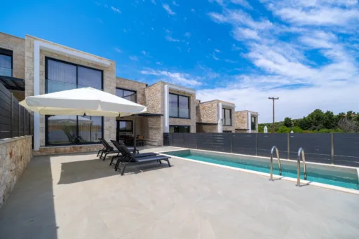 Private pool and garden area with sun loungers at Villa Iris