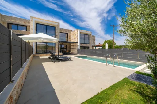 Landscaped garden and private swimming pool at Villa Lithos vacation rental