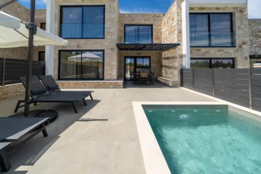 Private pool terrace and sun loungers at Villa Lithos in Poseidi