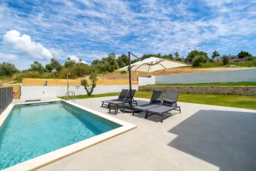 Swimming pool and garden façade of Villa Theros vacation rental